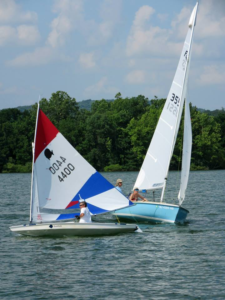 A sunfish and Flying Scot during a Sunday Race day